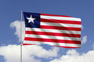 Liberia flag fluttering in the wind on sky.
