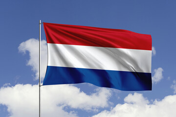 Netherlands flag fluttering in the wind on sky.