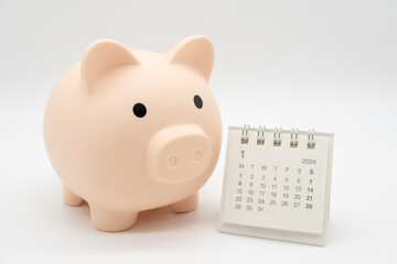 Piggy Bank and Desk calendar isolated on white background. For retirement, Pension Plan concept....