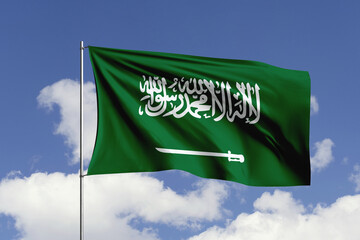 Saudi Arabia flag fluttering in the wind on sky.