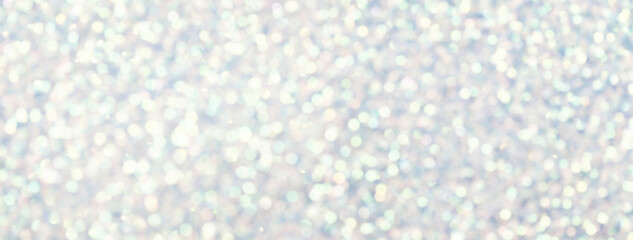 Blurred white background with circle sparkling lights. Shiny brilliant glittery bokeh of christmas...