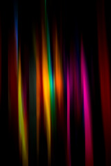 abstract linescolored background, colored stripes on a dark background