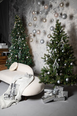 Gifts in boxes lie under the New Year tree