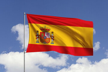 Spain flag fluttering in the wind on sky.