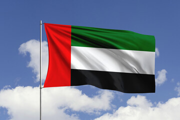 United Arab Emirates flag fluttering in the wind on sky.