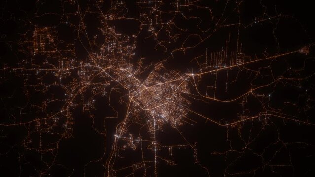 Alexandria (Louisiana, USA) top view at night. View on modern city from satellite. Camera is zooming in, rotating counterclockwise. Vertical video. The north is on the left side
