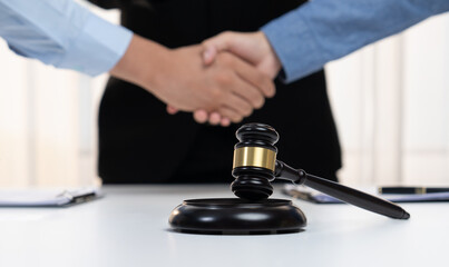 Lawyer acting as legal mediator successfully broke a compromise and seal with handshake between two...