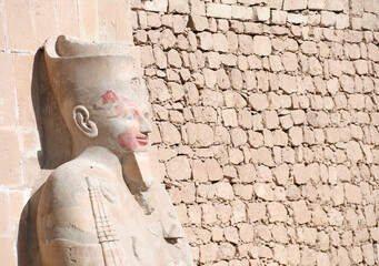 Statue of Queen Hatshepsut at entrance of Deir el-Bahari (Deir el-Bahri) the Mortuary Temple of...