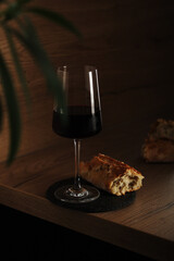 A glass of wine with bread in minimalistic style	