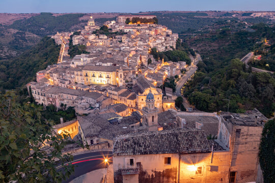 Italy, Sicily, Modica, Old town seen from Duomo of San Giorgio at dusk