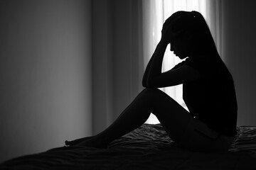 Silhouette of a woman with symptoms of depression and depression, Sadness, Anxiety, Family Problems, Mentally ill Person, Domestic Violence - obrazy, fototapety, plakaty