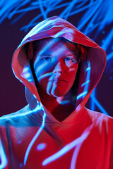 Futuristic modern portrait of young, calm man posing in vivid neon, abstract digital multicolored...