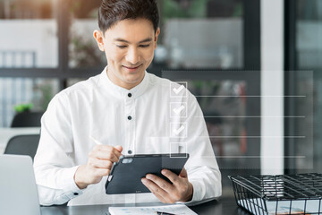 Businessman using tablet to do online checklist survey, doing assessment online survey answer test questions Digital form.