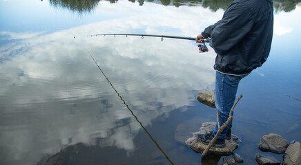 Fisherman catches fish. Fishing. Hobby