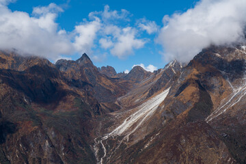 Trekking in the Kanchenjunga Conservation Area with dark Cloudy Himalyaan Mountains, Forest, Village