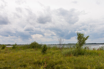 Lake in windy and cloudy weather.