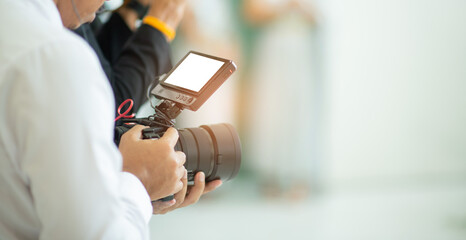 Video camera with blur background - obrazy, fototapety, plakaty