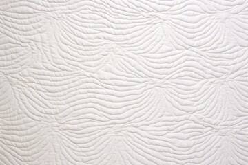 detailed shot of a quilted canvas in white