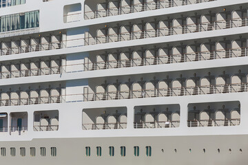 Lines of cabins and balconies of big cruse liner. Close up, side view. Kushadasi, Turkey