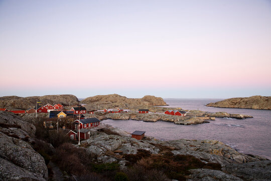 Fishing cabins on coat under clear sky
