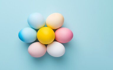 Easter eggs decorated in pastel color on a light blue background. Easter concept