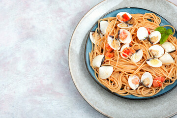 Dish of spaghetti with clams, copy space.