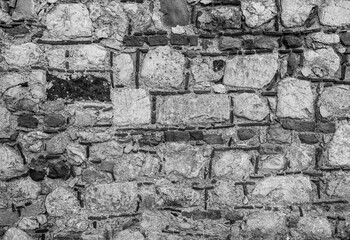 monochrome texture of old wall or pavement closeup, black and white gray background macro, wallpaper for design