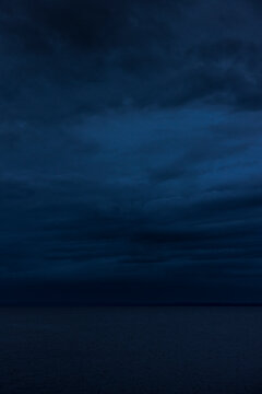 Clouds over sea at night