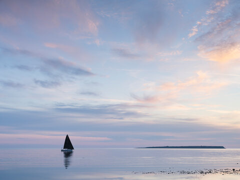Yacht on sea during sunset