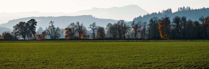  Layered Farmland, Trees, Mountains at sunset during Fall in Williamette Valley, Oregon - Panoramic...