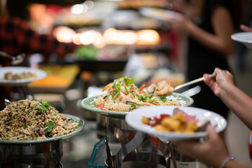 scooping the food, catering, dinner time