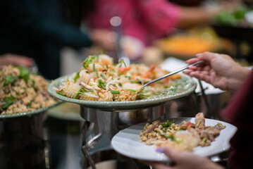 scooping the food, catering, dinner time