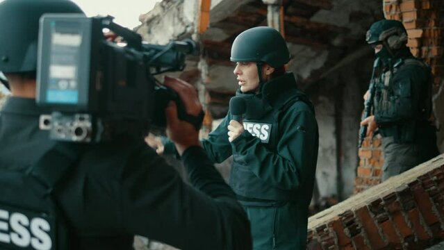 Female war journalist reporting live on the war zone