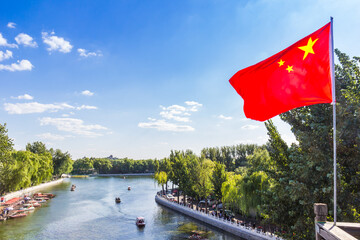Chinese national flag at the Qianhai lake in Beijing, China - obrazy, fototapety, plakaty