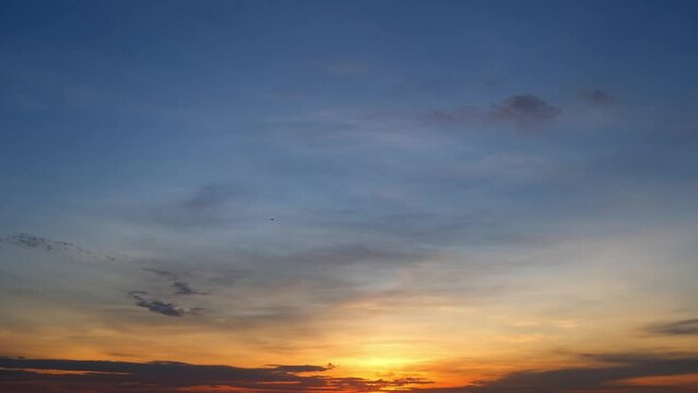 4K : Sunset sky timelapse, Daylight gracefully fades as soft, pastel hues blend in the sky, and swift-moving clouds paint a tranquil picture in this time-lapse masterpiece. Cloud background.
