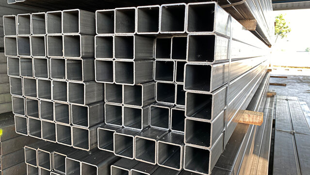 Metal profile pipe of rectangular cross section in packs at the warehouse of metal products