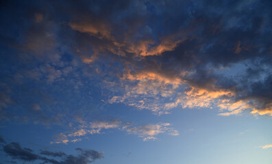 Obraz premium Sunset sky with orange clouds. Nature background.