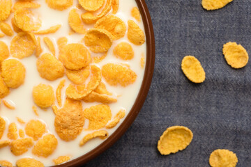 Corn flakes with tar in a bowl close-up. Top view