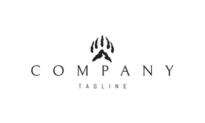 Obraz premium A vector logo with an abstract image of a bear paw with a silhouette of a mountain.
