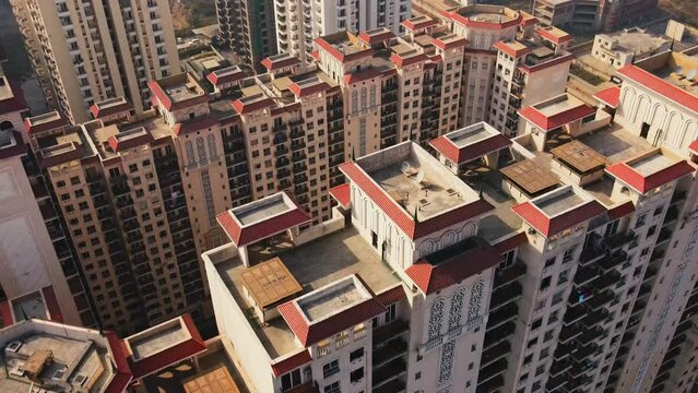 Aerial view of Greater Noida City in Uttar Pradesh, India. Construction of a multi-story Residence apartment building. Drone shot of modern City high-rise skyscraper buildings in India.
