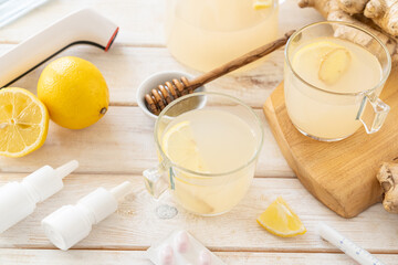 Natural cold remedies concept - ginger tea and ingredients, drugs, thermometer