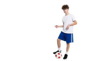 PNG of a teenage boy playing soccer isolated on a white background.