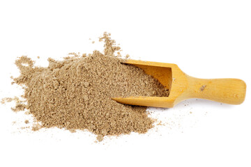 Pile of flax flour with wooden scoop isolated on a white background