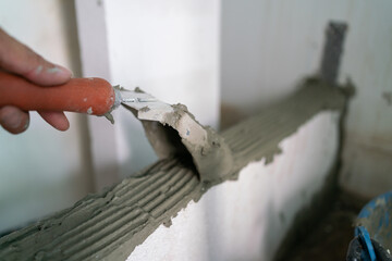 Cement plastering with white brick interior building