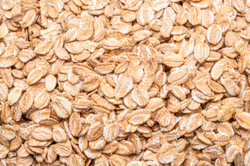 Wheat flakes close up. Healthy food background.