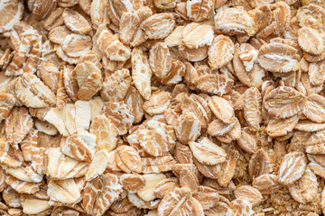 Wheat flakes close up. Healthy food background.