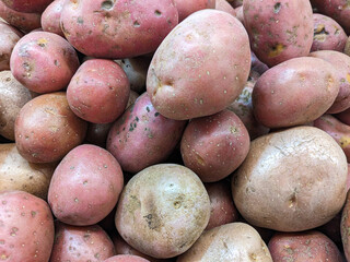 Background of red or pink potatoes top view.