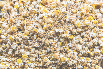 Herbal tee sold at Egypt Bazaar (Misir Carsisi) in Istanbul, Turkey (Turkiye). Dried camomile blossoms. Selected focus, copy space, toning. Organic herbal background or wallpaper