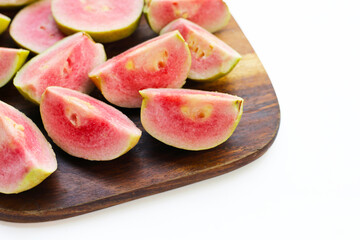 Fresh pink guava on white background.