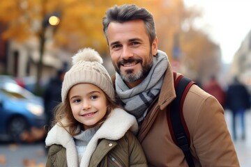 Happy and cheerful father and daughter walking on the street.  Heartwarming family moments